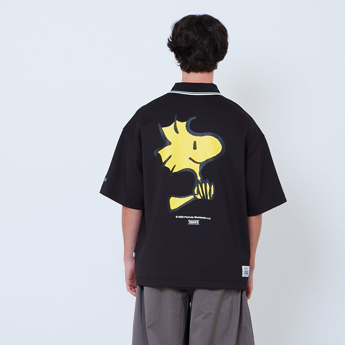 Peanuts Gender Neutral Printed Oversized Jersey Polo Tee - Black - PU2605004B